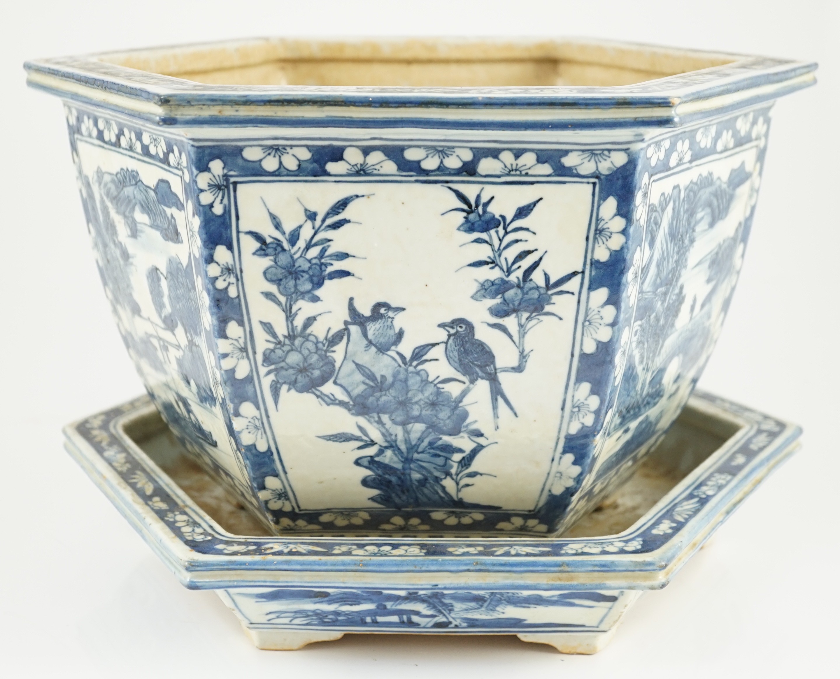 A Chinese hexagonal blue and white planter and underdish, 19th century, 35cm wide, two rim chips